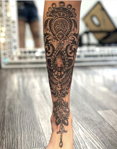 Explore religious tattoo ideas for women, creative tattoo ideas in Fort Wayne, available at Attraction Tattoos