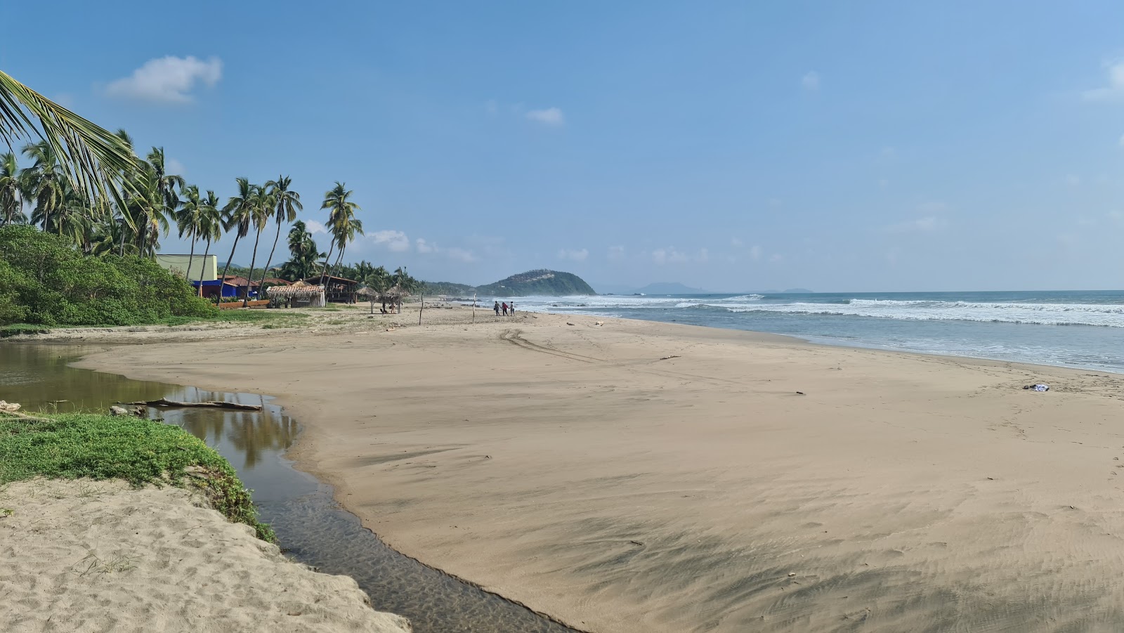 Foto di Playa Troncones con una superficie del sabbia beige fine