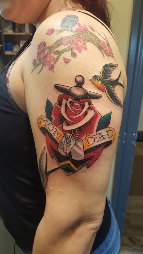 Explore broken glass tattoo ideas, creative tattoo ideas in Massapequa, available at Kings Avenue Tattoo