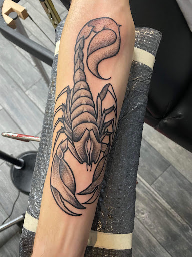Explore red ink neck tattoo ideas, creative tattoo ideas in El Paso, available at American Tattoo Society of Ft Bliss