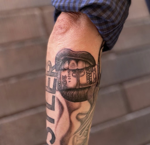 Explore red string tattoo ideas, creative tattoo ideas in Peoria, available at Modern Ink Tattoo