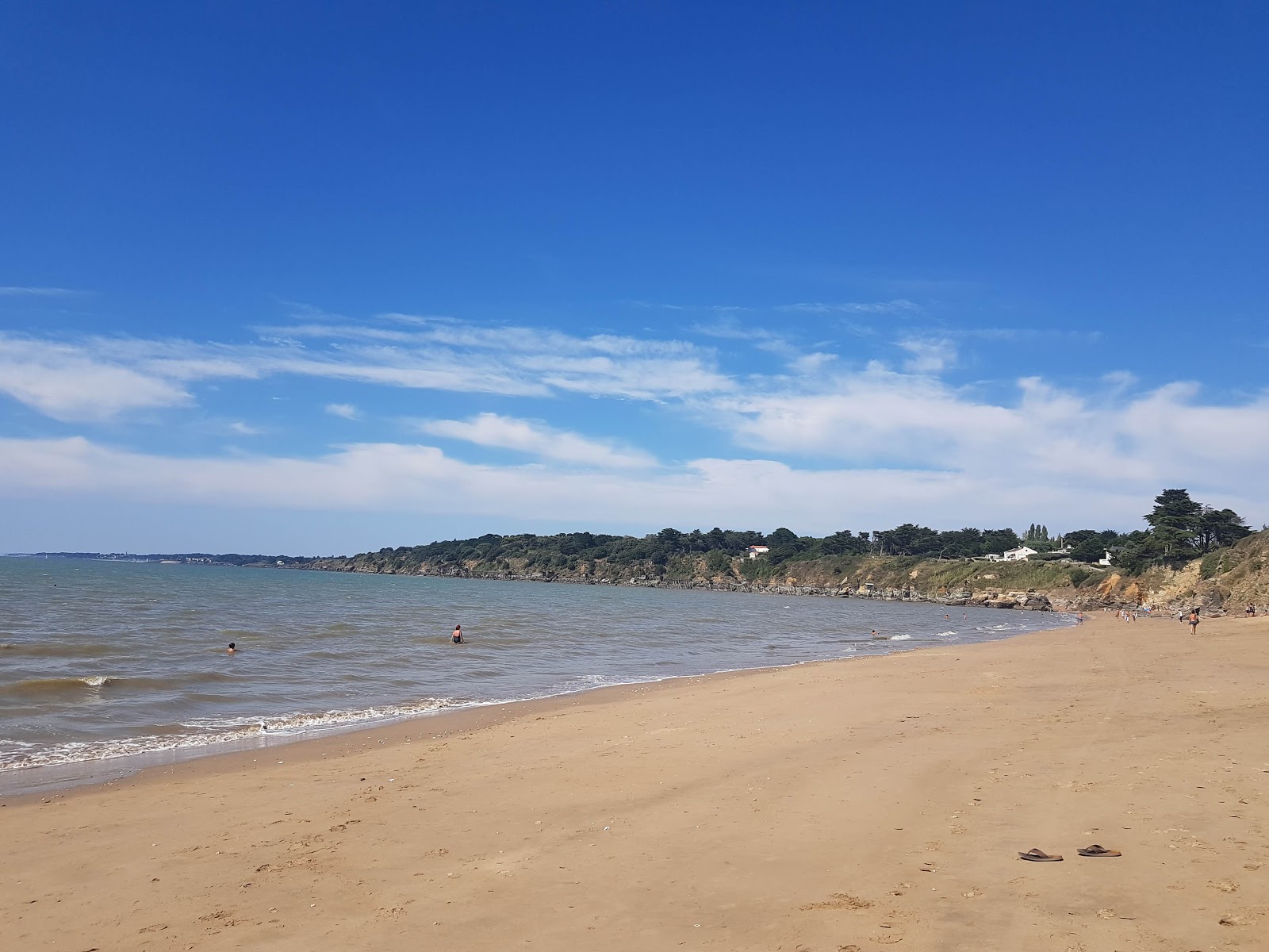 Foto di Creve Coeur beach con una superficie del sabbia beige