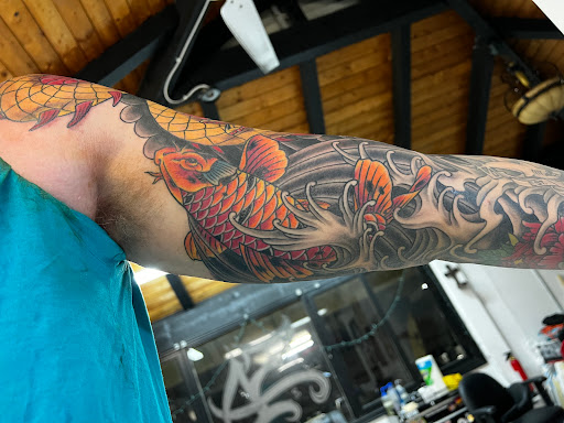 Explore tattoo ideas upper back, creative tattoo ideas in Honolulu, available at Sacred Art Tattoo Waikiki