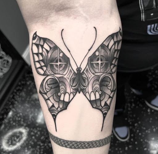 Explore mothman tattoo ideas, creative tattoo ideas in Fort Myers, available at Loyal 2 The Coil Tattoos & Piercings (Edison Mall Location Entrance F)