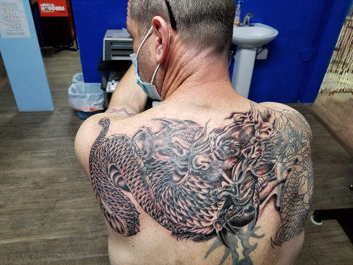 Explore back arm tattoo ideas for guys, creative tattoo ideas in Abilene, available at Ink Image Tattoos