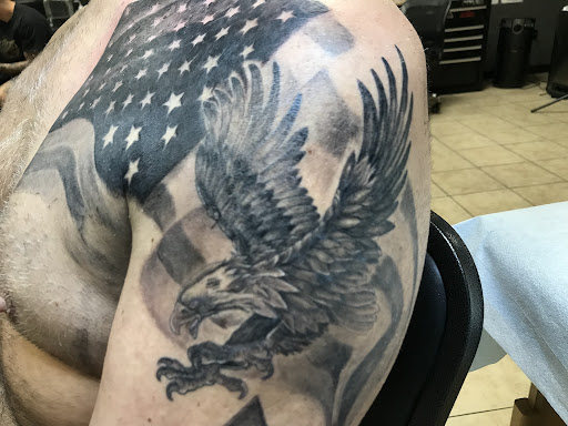 Explore arrow tattoo ideas for men, creative tattoo ideas in Houston, available at 333 Tattoo Studio HTX