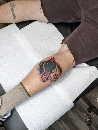 Explore minimalist cat tattoo ideas, creative tattoo ideas in Fort Wayne, available at Attraction Tattoos