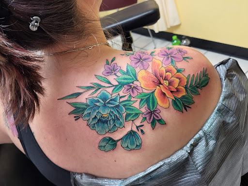 Explore female neck tattoo ideas, creative tattoo ideas in Grand Ledge, available at Van Gogh Tattoos