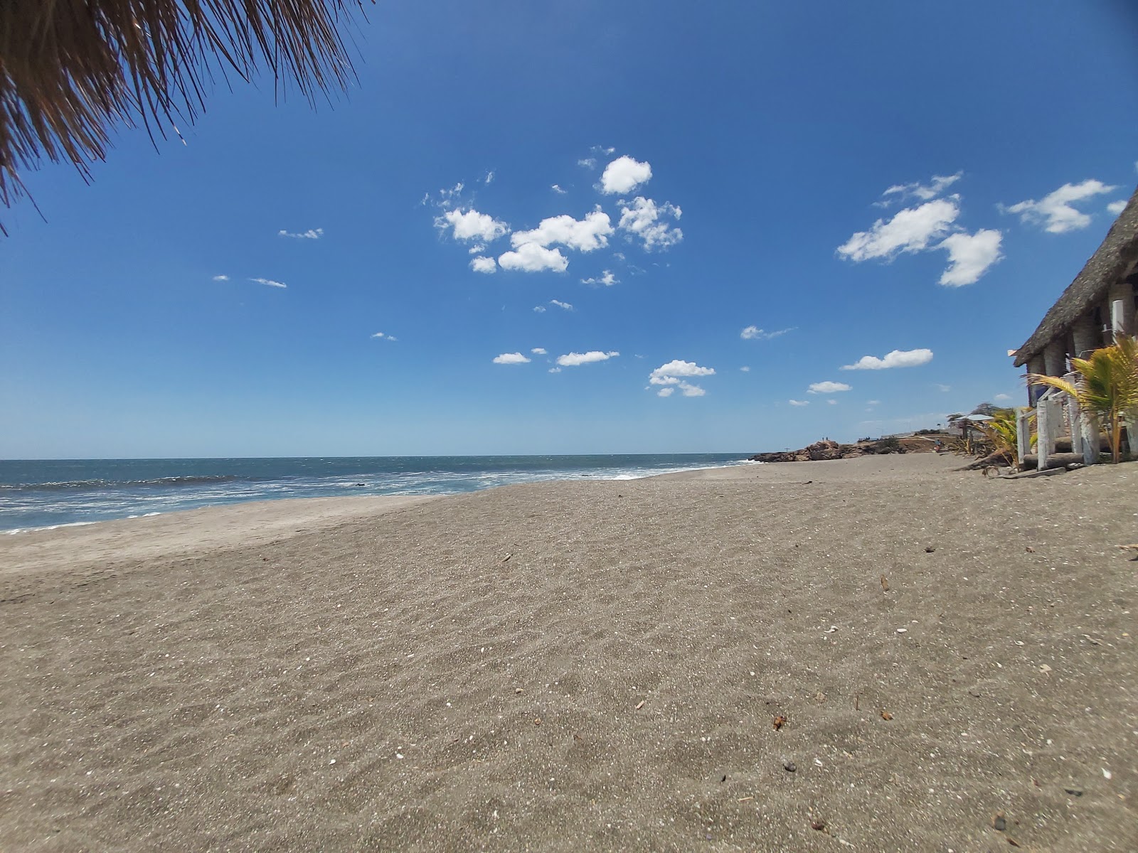 Foto von Las Penitas beach mit grauer sand Oberfläche
