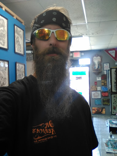 Explore ouroboros tattoo ideas, creative tattoo ideas in Bradenton, available at Memory Lane Tattoo Co.