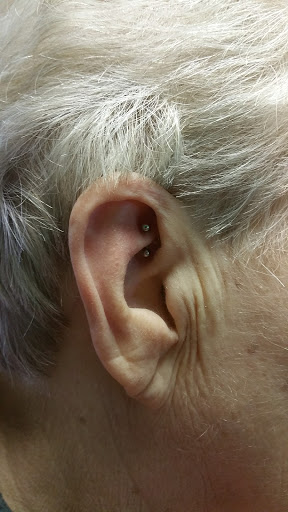 Explore name tattoo ideas for females, creative tattoo ideas in Fritch, available at Stars & Stripes Electric Tattoos