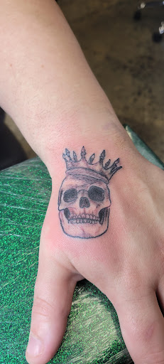 Explore tricep tattoo ideas for men, creative tattoo ideas in Canton, available at DEAD KAT TATTOO