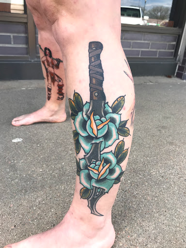 Explore leg tattoo ideas for men, creative tattoo ideas in Kearney, available at Bread N Butter Tattoo