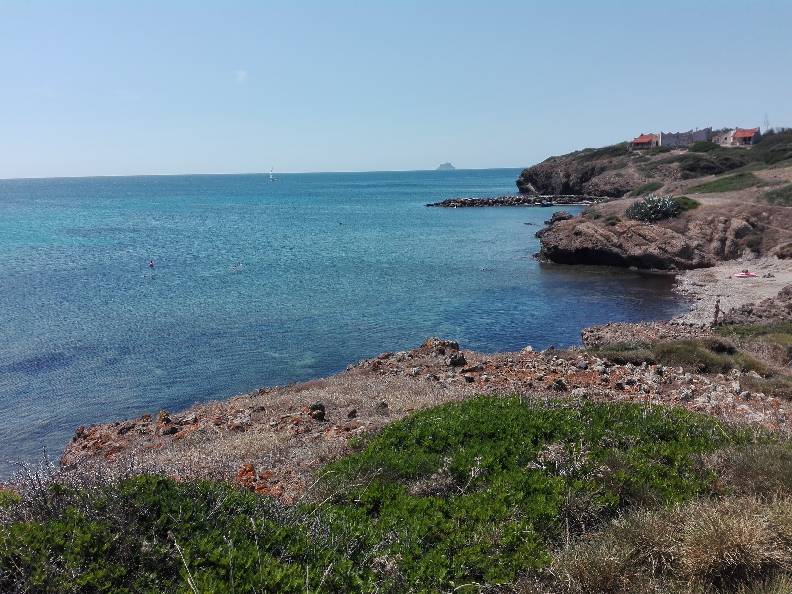 Capo Sperone Beach'in fotoğrafı doğal alan içinde bulunmaktadır