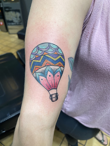 Explore flower tattoo ideas on arm, creative tattoo ideas in Taos, available at Muerte Tattoo Taos