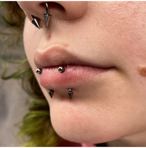 Explore little hand tattoo ideas, creative tattoo ideas in Marietta, available at The Queen Bee Tattoo and Piercing Parlour