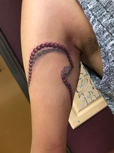 Explore graduation cap tattoo ideas, creative tattoo ideas in Saint Petersburg, available at Buku Tattoo Studio