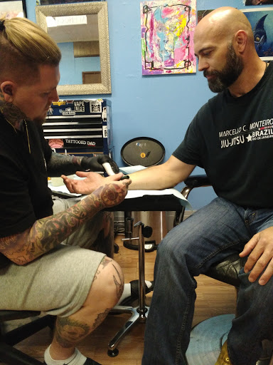 Explore tattoo ideas for men with daughters, creative tattoo ideas in Wheeling, available at SPFX Tattoo