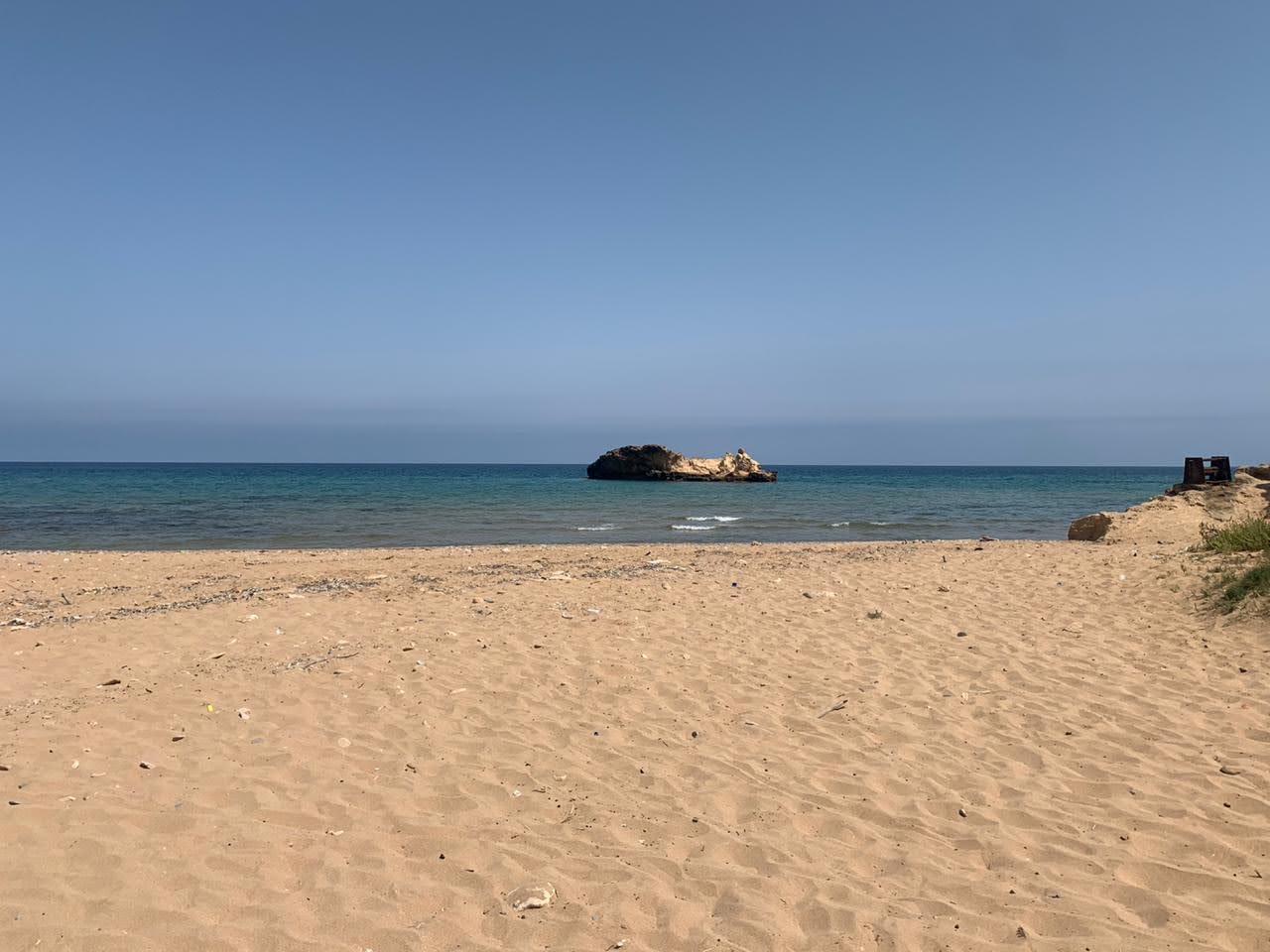 Photo of Red beach with very clean level of cleanliness