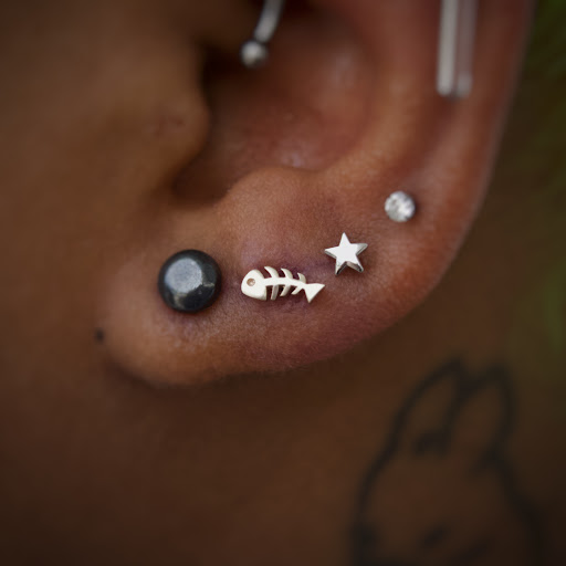 Find palm size tattoo ideas for females for your next unique tattoo in Corona Del Mar at Rainbow Piercing & Jewelry