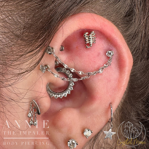 Explore crucifix tattoo ideas, creative tattoo ideas in Bloomington, available at Crystal Moon Body Arts