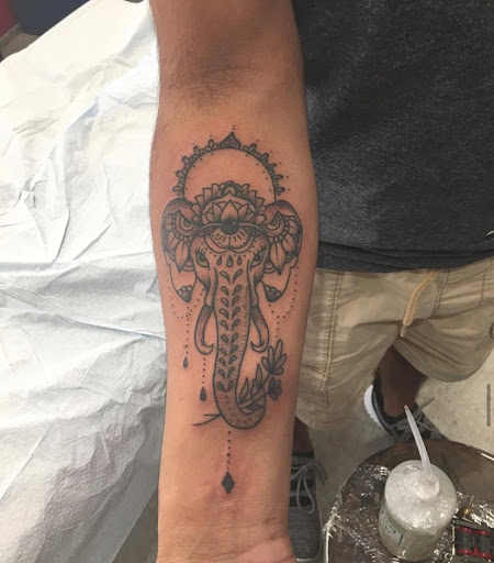 Explore tattoo ideas for first born son, creative tattoo ideas in Kansas City, available at Grimm Tattoo and Bert Grimm Museum