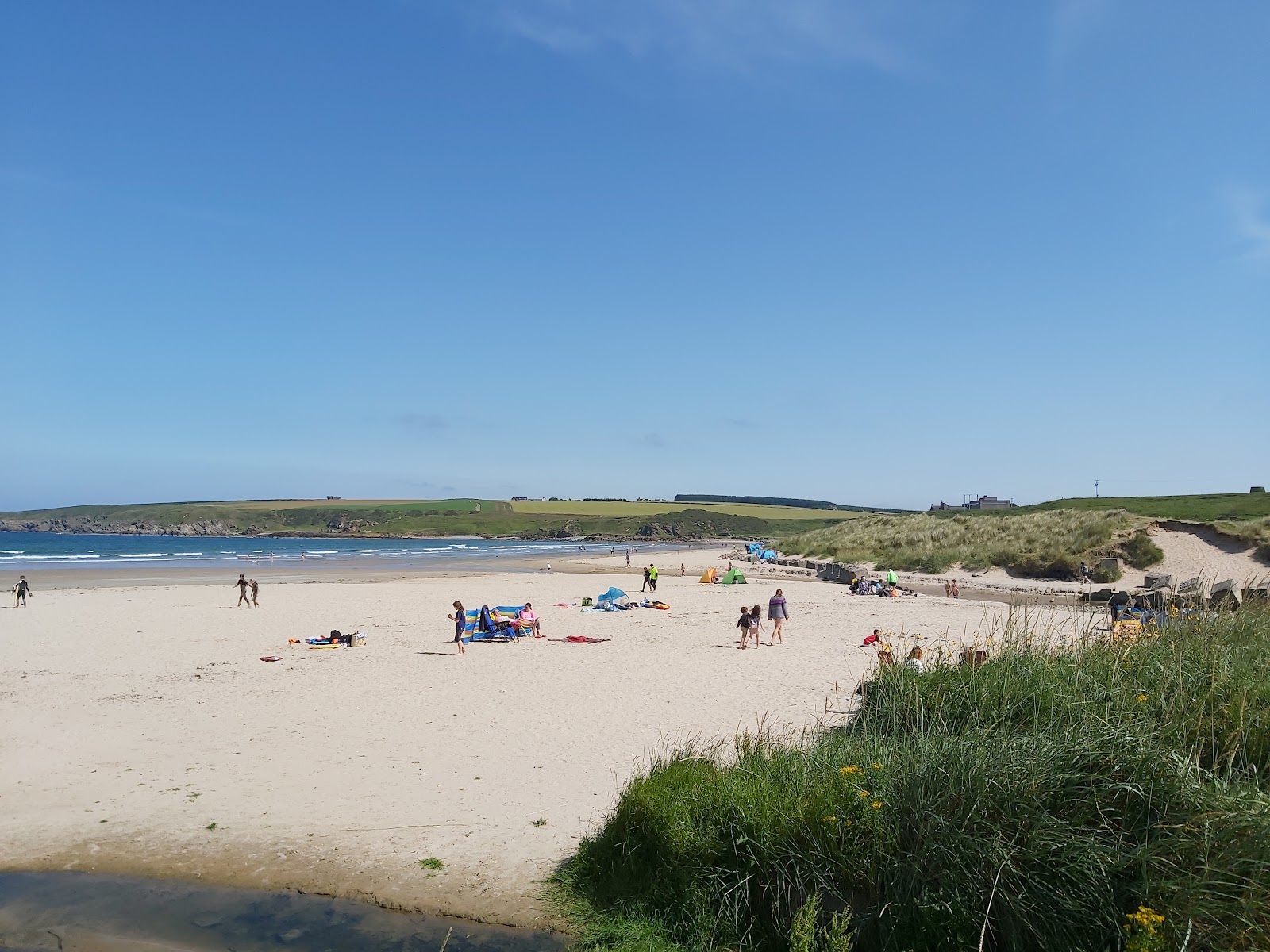 Photo of Sandend Beach with bright sand surface