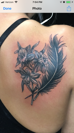 Explore traditional knee tattoo ideas, creative tattoo ideas in Philadelphia, available at Daves Artistic Tattoo