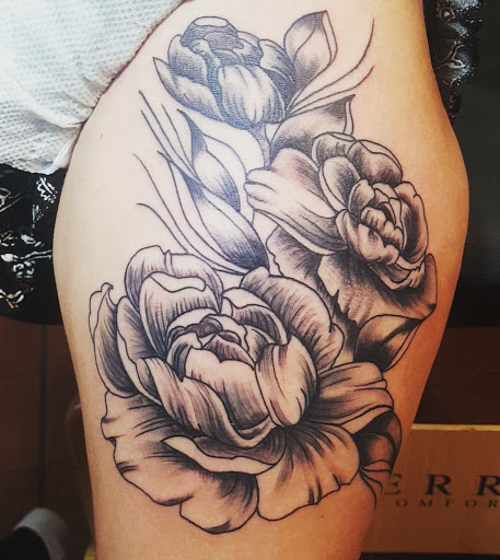 Explore lone wolf tattoo ideas, creative tattoo ideas in Orange Park, available at Big City Tattoo and Piercing