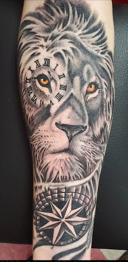 Explore tattoo ideas lion, creative tattoo ideas in Mchenry, available at Lunchbox Tattoo and Body Piercing