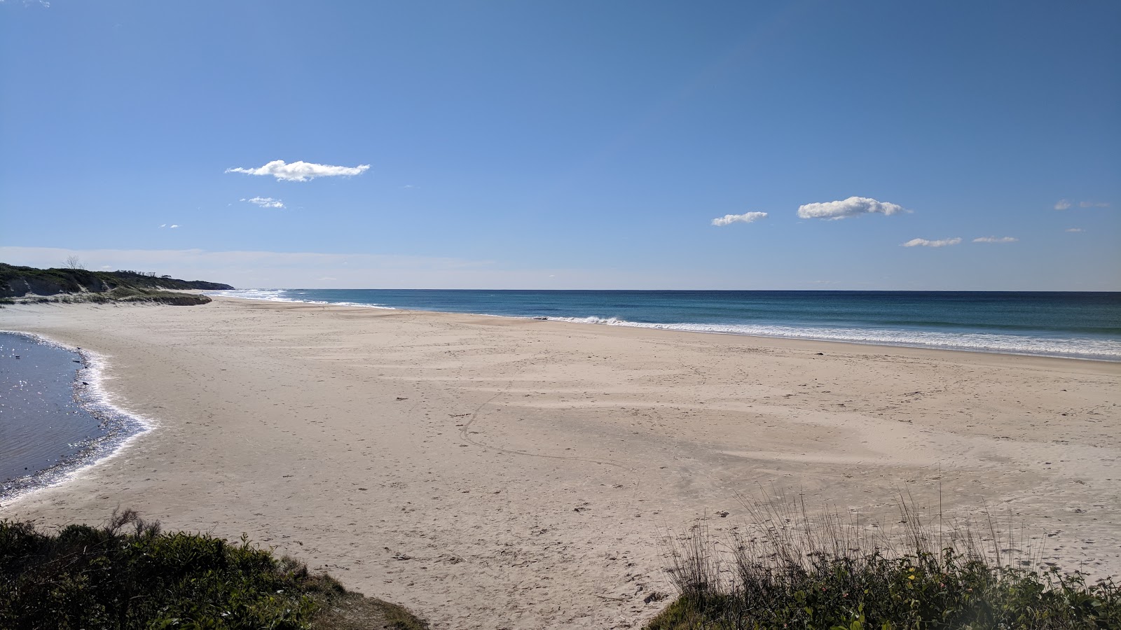 Fotografija Plumbago Beach z svetel pesek površino