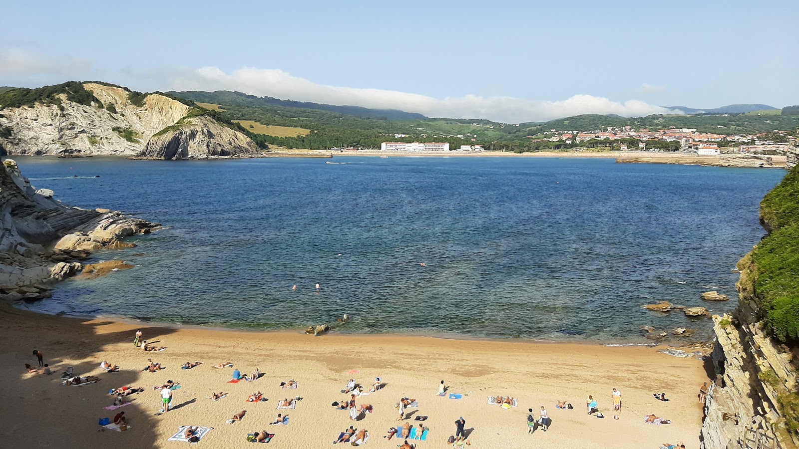 Photo of Playa De Muriola with blue pure water surface