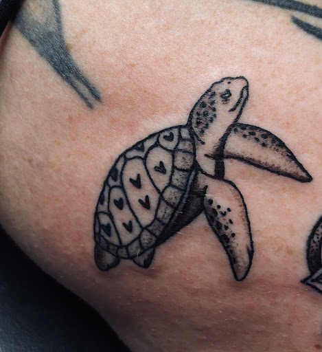 Explore emperor's new groove tattoo ideas, creative tattoo ideas in North Tonawanda, available at Dark Side Ink Tattoo Studio