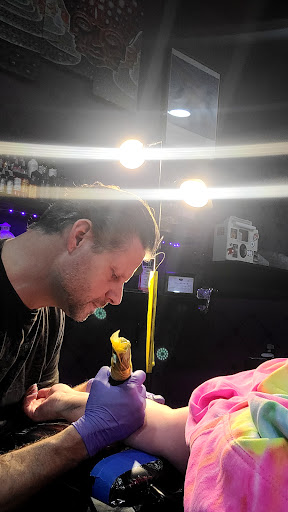 Explore back piece tattoo ideas female, creative tattoo ideas in Cleveland, available at Divine Image Ink Tattoo and Piercing Studio