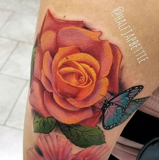 Explore apple tattoo ideas, creative tattoo ideas in Fontana, available at Dark Hearts Tattoo Gallery