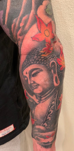 Explore arm blackout tattoo ideas, creative tattoo ideas in Addison, available at Cat Tattoo