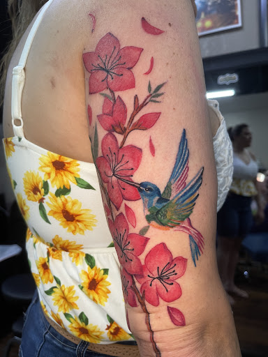 Explore floral tattoo sleeve ideas, creative tattoo ideas in Roanoke, available at Saint Cecilias Art Studio