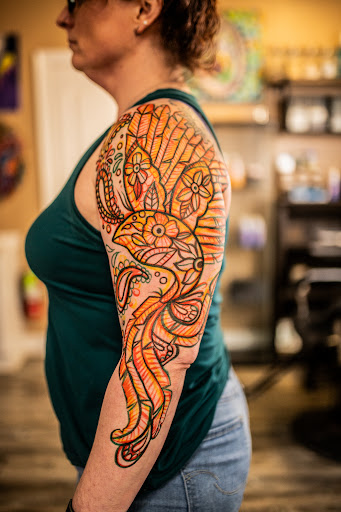 Explore gangster sleeve tattoo ideas, creative tattoo ideas in Leesville, available at Revolution Ink Tattoo and Art Gallery