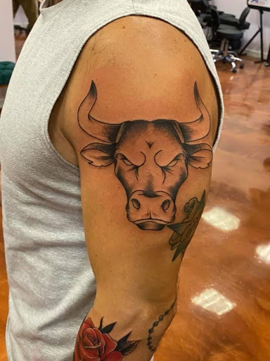 Explore tricep tattoo ideas for men, creative tattoo ideas in Aledo, available at Elevated Tattoo & Piercing