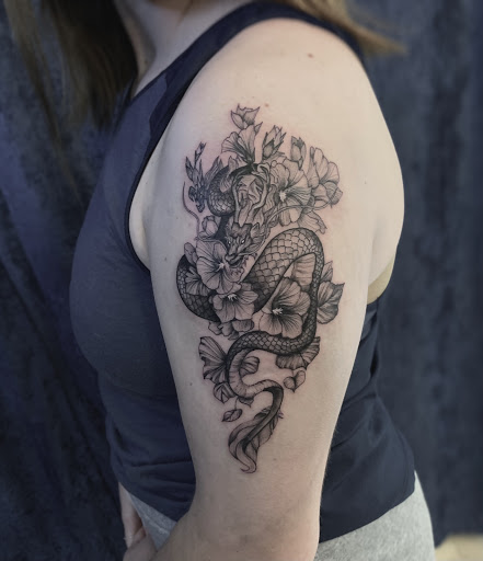 Explore dragon tattoo cover up ideas, creative tattoo ideas in Houston, available at Black Swan Tattoo Studio