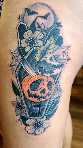 Explore back ear tattoo ideas, creative tattoo ideas in Ocoee, available at Slaughterized Ink Tattoo and Piercing Studio