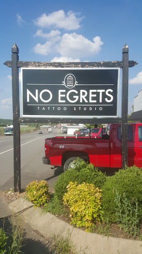 Explore black and white tattoo ideas for men, creative tattoo ideas in Clarksville, available at No Egrets Tattoo Studio