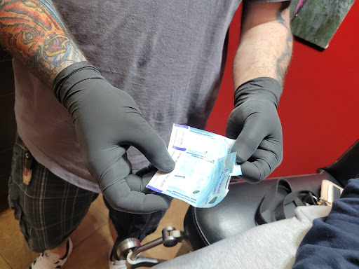 Explore dog love tattoo ideas, creative tattoo ideas in Brandon, available at Hot Box Tattoos