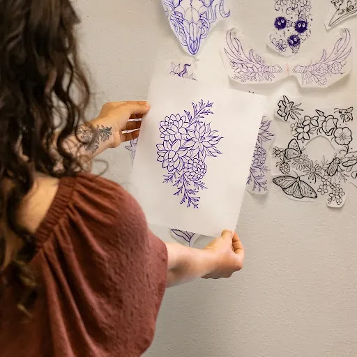 Explore arm tribal tattoo cover up ideas, creative tattoo ideas in Kingston, available at Stinging Nettle Studio