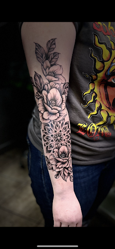 Explore wrist wrap tattoo ideas, creative tattoo ideas in Osage Beach, available at Lake Ozark Tattoo and Hair Studio