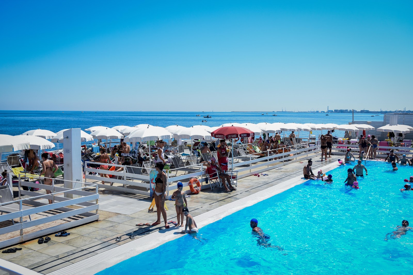 Photo of Lido inmaredentro beach with blue pure water surface