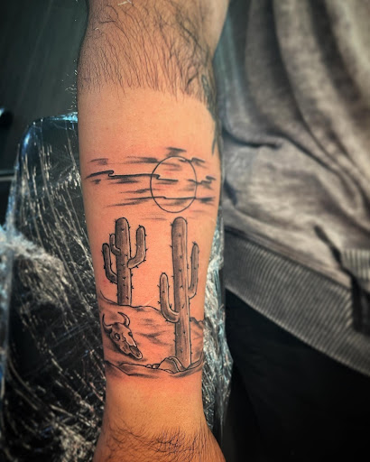 Explore manifestation tattoo ideas, creative tattoo ideas in Palm Harbor, available at Angry Owl Tattoo and Piercing