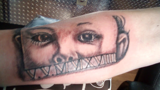 Explore leg tattoo cover up ideas, creative tattoo ideas in Dayton, available at Uppity Tattoos