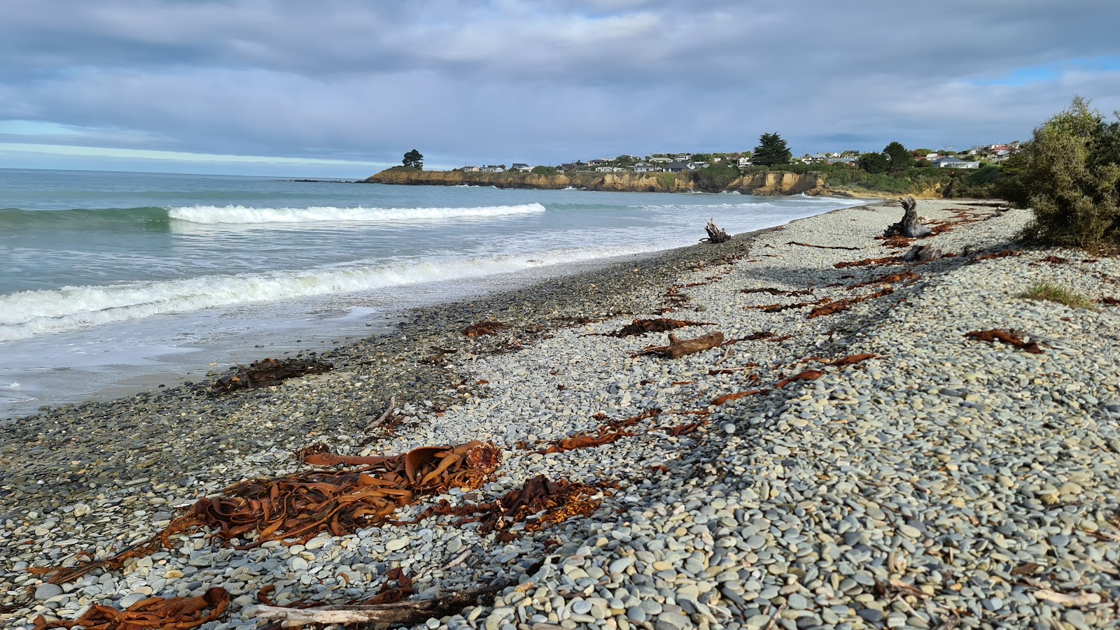 Foto av Kakanui Beach med lång rak strand