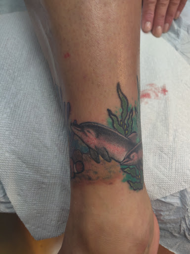 Explore mental health ribbon tattoo ideas, creative tattoo ideas in Lockport, available at Tattoo City by Larry Brogan